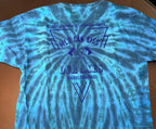 A blue and teal tie-dye t-shirt laid flat on a brown surface, featuring a dark blue graphic print on the back with the words 'World Can Kiss Our Axes' and 'Axelstrong'. 