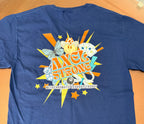 A blue short-sleeve t-shirt laid flat on a tan surface, showing a large colorful back graphic with the words 'AXEL STRONG' and smaller text 'METACHROMATIC LEUKODYSTROPHY.' 
